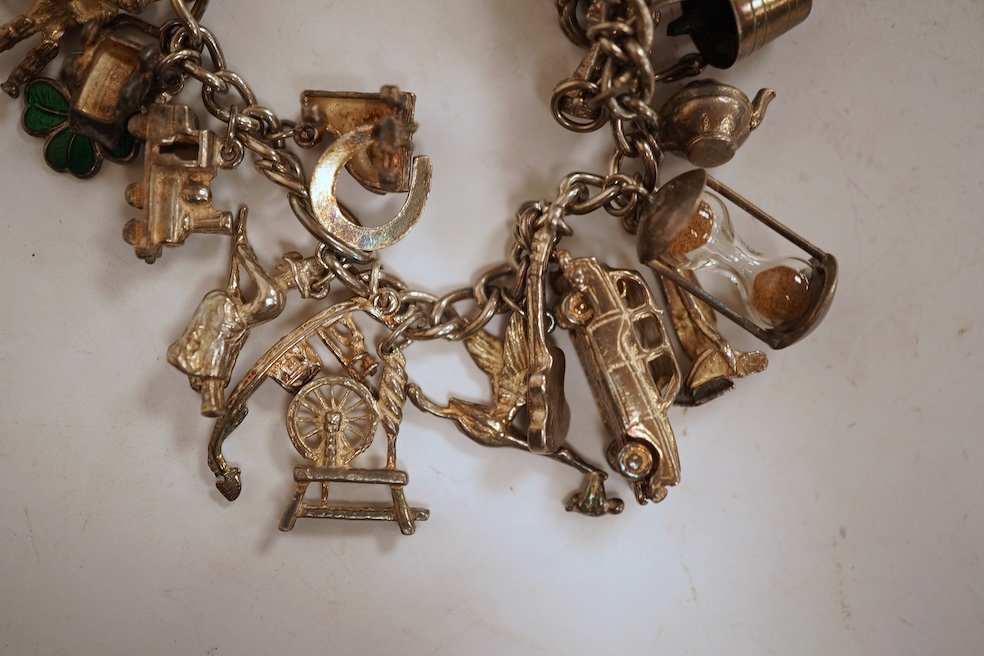 A white metal hunter keywind pocket watch, with Roman dial and subsidiary seconds, two silver charm bracelets and sundry items including jewellery and a silver sovereign case.